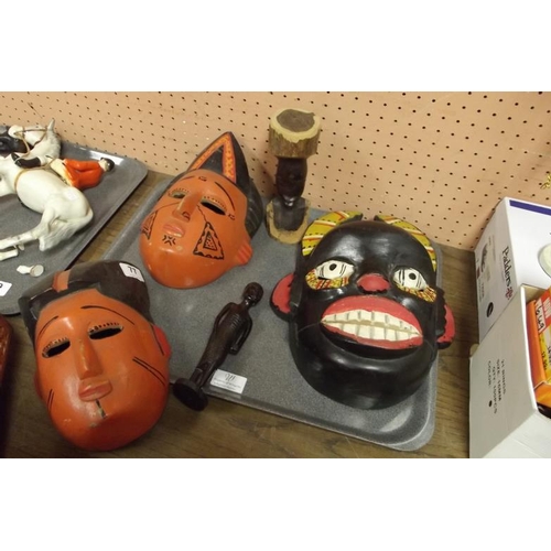 77 - Various painted carved wood masks.