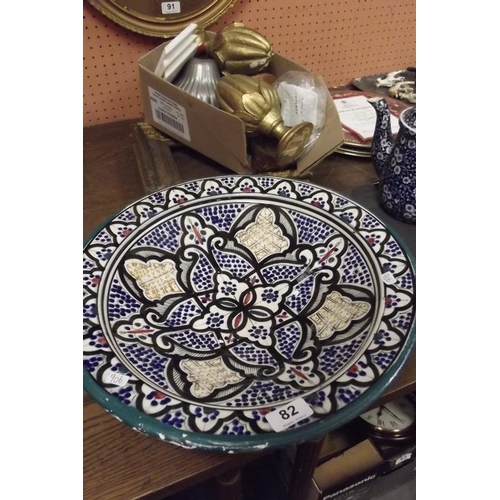 82 - Eastern glazed terracotta bowl, 16 in. diameter, pair of painted wood finials, etc.