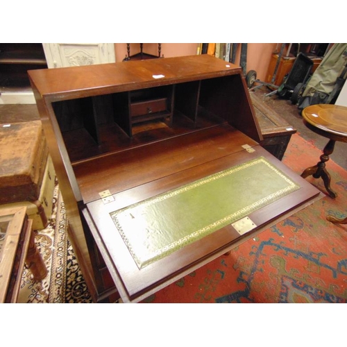 283 - Reproduction mahogany bureau, fall front revealing a fitted interior over three long drawers with me... 