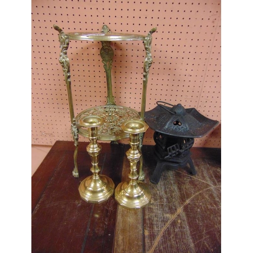 316 - Brass two-tier pan stand, pair of brass candlesticks, and a lantern. (3)