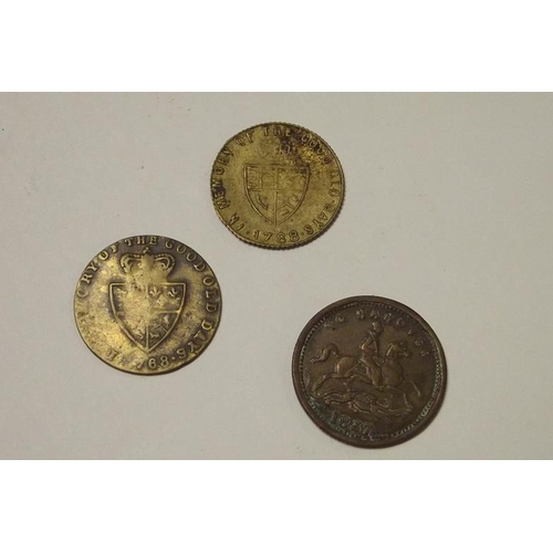 134 - Two George III gambling tokens, and a Victorian gambling token.