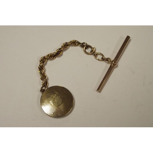 141 - Victorian gold mourning locket and chain with gold T-bar.