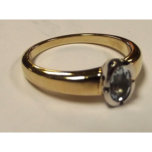 176 - 9 ct. yellow gold ring set with pale blue stone, size O, 3.8 g.