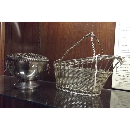 224 - Silver plated wirework bottle caddy, together with a plated rose bowl. (2)