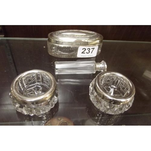 237 - Oval silver-lidded dressing table jar, pair of silver rimmed salts, and a small silver-lidded jar. (... 