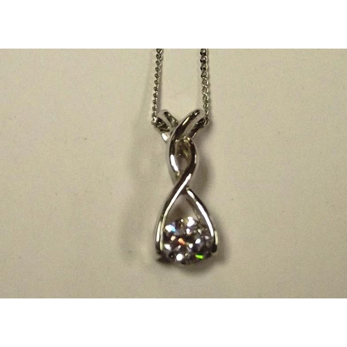 27 - 9ct white gold solitaire pendant with fine chain.