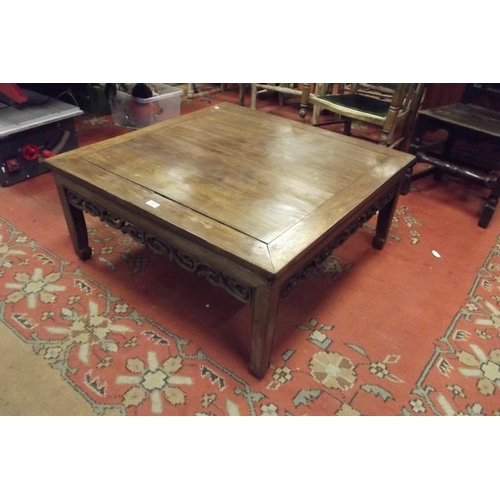 307 - Oriental square form coffee table having carved frieze and on plain supports, 16 in. x 36 in. x 36 i... 