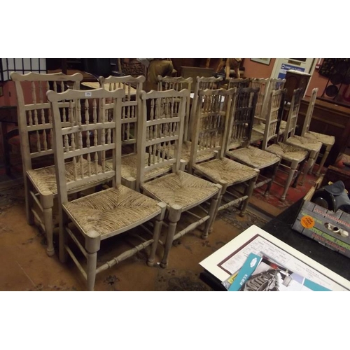 314 - Set of fourteen spindle back rush seated country chairs.