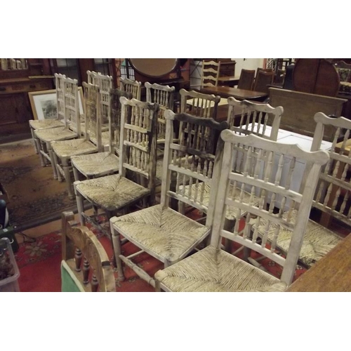 314 - Set of fourteen spindle back rush seated country chairs.