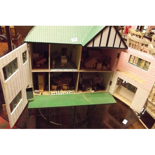 315 - Wooden doll's house and contents.