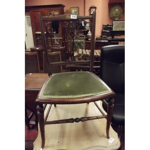 318 - Edwardian inlaid nursing chair having pierced back and upholstered seat.