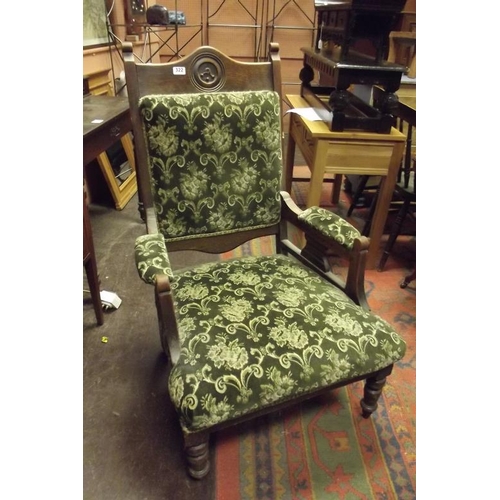 322 - Late 19th Century oak gentleman's chair having upholstered back, arms and seat set on turned frontal... 