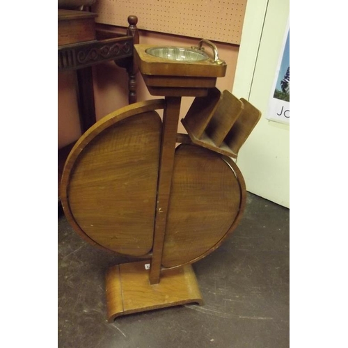 323 - Art Deco walnut veneered smoker's stand having pair of folding shelves, 30 in. high.