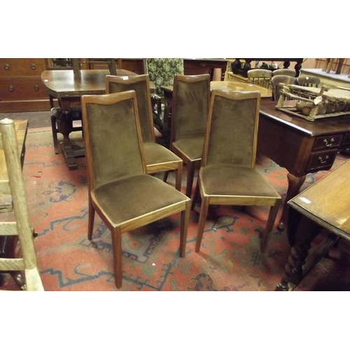 332 - Set of four teak G-Plan framed dining chairs having upholstered backs and seats.