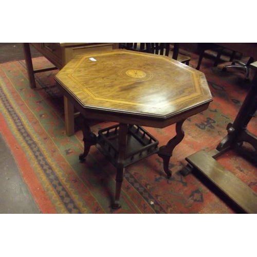 340 - Inlaid walnut octagonal topped centre table set on shaped supports joined by an undertier, 27 in. hi... 