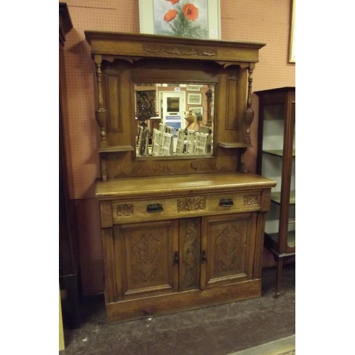 348 - An oak sideboard, mirror back over two drawers above pair of doors and on plinth base, 72 in. x 46 i... 