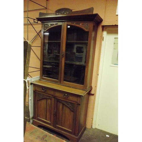 357 - Walnut cupboard bookcase, ogive cornice above pair of glazed doors, shelf lined interior, two short ... 