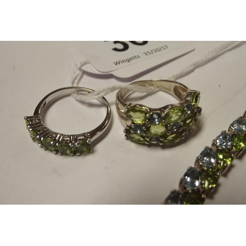 36 - Silver sky blue topaz and peridot bracelet, and two rings to match.