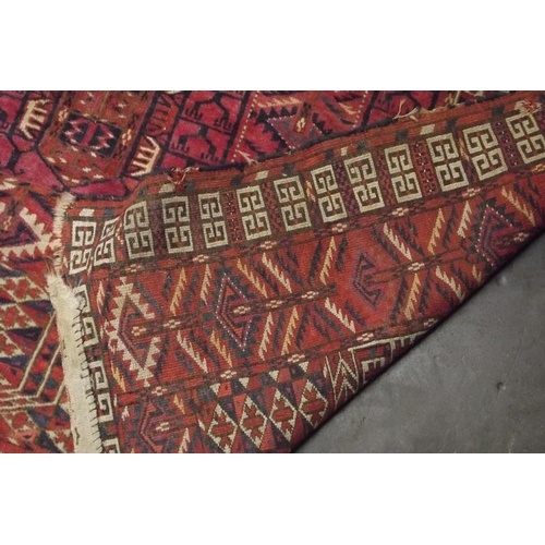 37 - Old Persian red ground hand-made wool rug, allover geometric pattern, approximately 65 in. x 50 in.