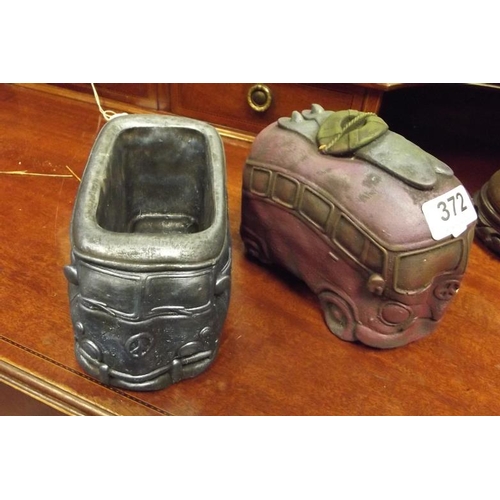 372 - Pair of stoneware VW campervan models.