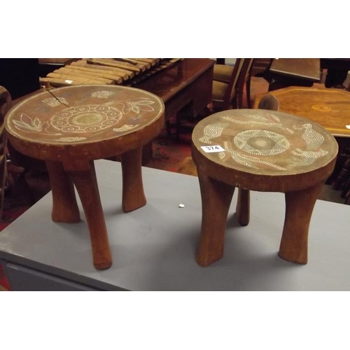 374 - Pair of Eastern stools, having beaded decoration, each 10 in. high.