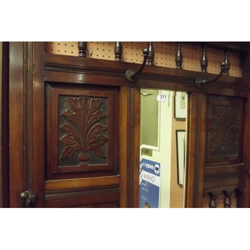 377 - Late 19th Century walnut mirror-back hall stand having spindle decoration, inset floral tiles, lift-... 