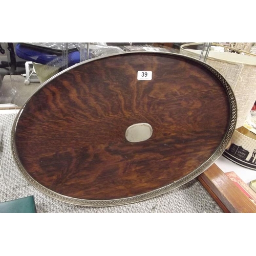 39 - Edwardian oval oak tea tray with plated gallery and mounts.