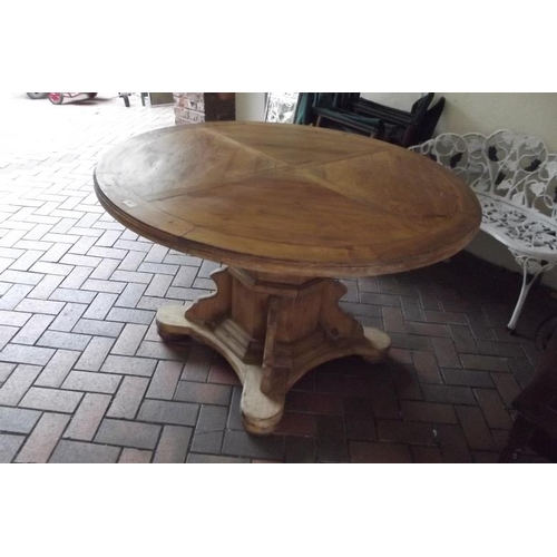 407 - Pine circular dining table set on quatre form base, 30 in. x 47 in.