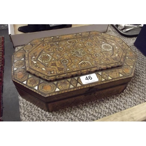 46 - Parquetry inlaid box containing a 32-piece carved wood chess set.