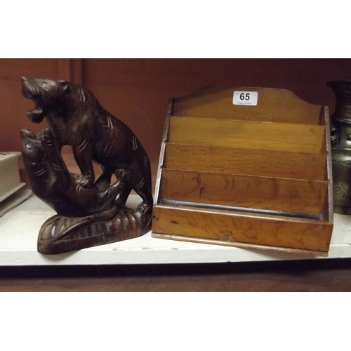 65 - Wooden letter rack, and a native carved wood animal group.