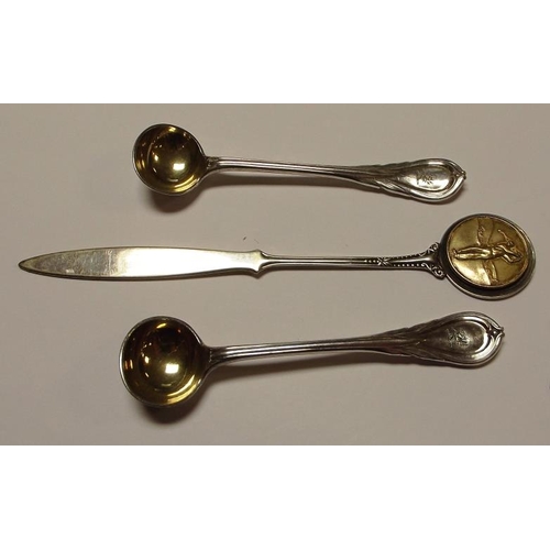 7 - Pair of plated salt spoons with gilded bowls, and a plated letter opener.