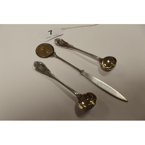 7 - Pair of plated salt spoons with gilded bowls, and a plated letter opener.