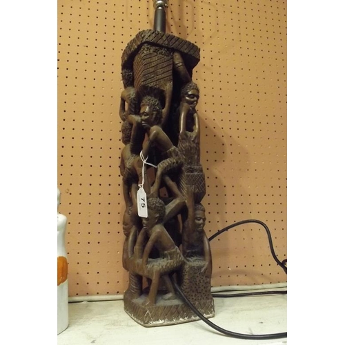 75 - Good native African 'human pyramid' carving, used as a lamp, 18 in. high.