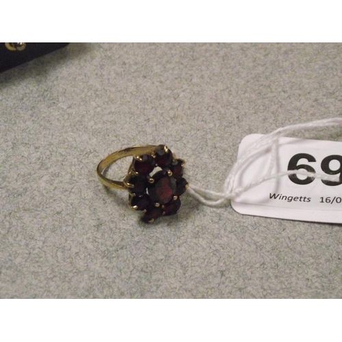 69 - 9 ct. yellow gold garnet ring, size N, 3.9 g.