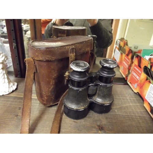 145 - Pair vintage binoculars in leather case.