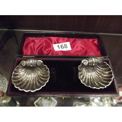 168 - Pair of silver shell form salts, Chester.