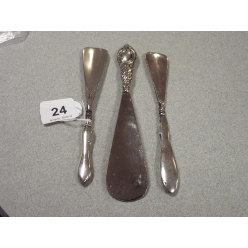 24 - Three silver-handled shoehorns.