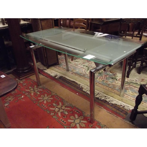 254 - Contemporary extending glass-topped dining table.