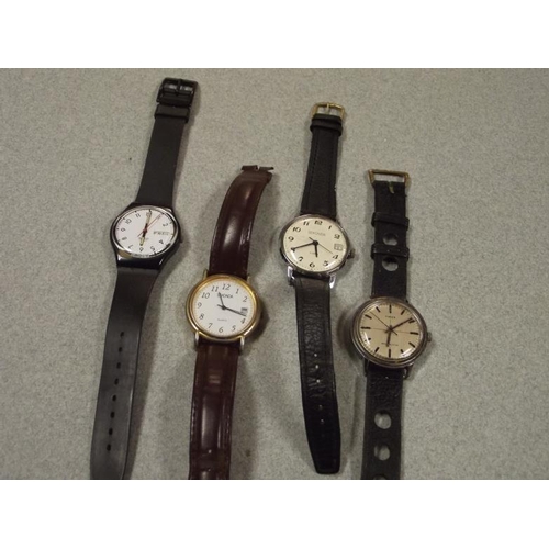 29 - Four gents wristwatches - Swatch, Sekonda, etc.