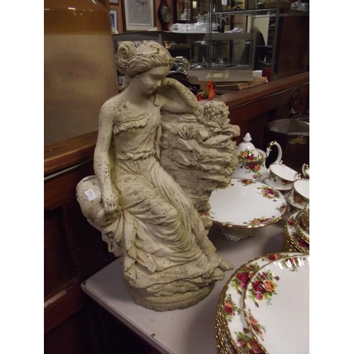 353 - Modern stoneware figure of a seated lady.