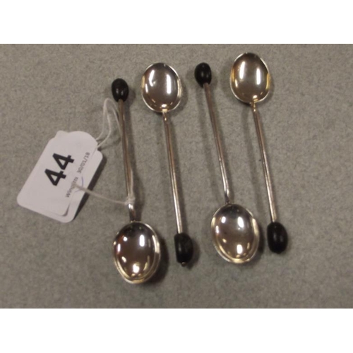 44 - Set of four silver coffee spoons with bean handles.