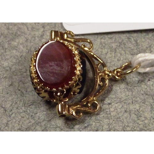 49 - 9 ct. yellow gold and hardstone swivel fob.