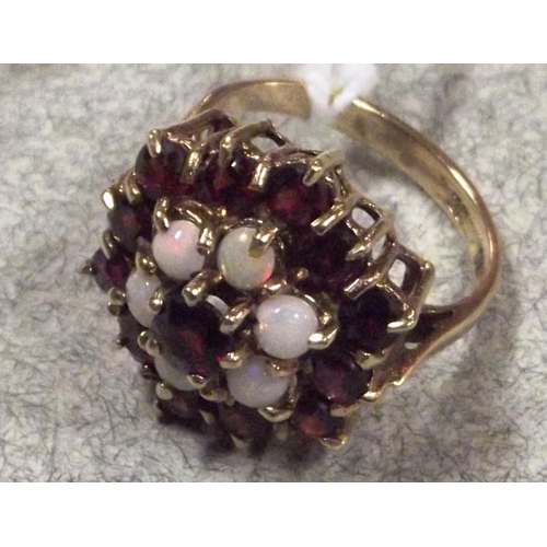 51 - Victorian 9 ct. yellow gold garnet and opal cluster ring, size N, 4.8 g., Birmingham 1897.