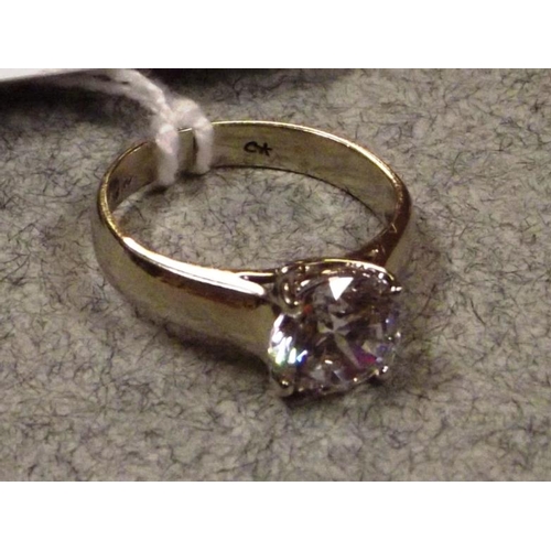 52 - 9 ct. white gold ring set with a clear solitaire stone, size M, 2.9 g.