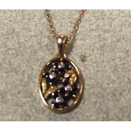 56 - 9 ct. yellow gold pendant set with sapphires and four diamonds, on a 9 ct. yellow gold fine link nec... 