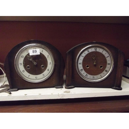 89 - Two oak cased dome top mantle clocks.