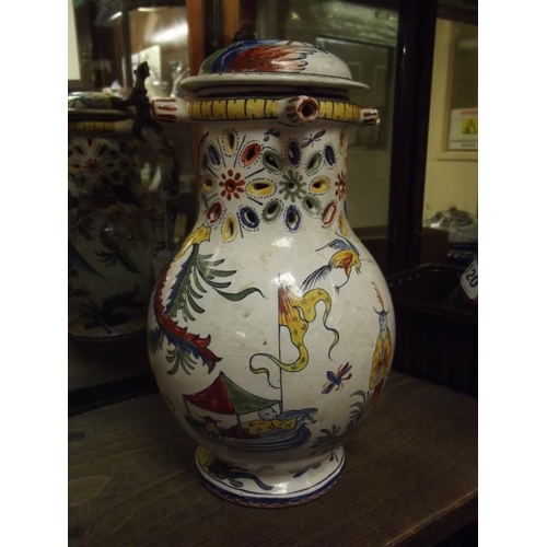 114 - Antique majolica puzzle jug decorated with Oriental figures, with hinged cover, 10 in. high (handle ... 