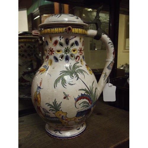 114 - Antique majolica puzzle jug decorated with Oriental figures, with hinged cover, 10 in. high (handle ... 