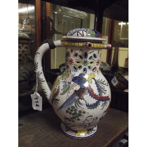 114 - Antique majolica puzzle jug decorated with Oriental figures, with hinged cover, 10 in. high (handle ... 