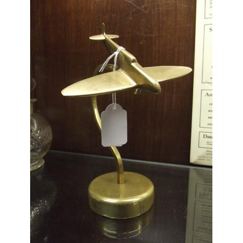 139 - Brass model Spitfire on stand.